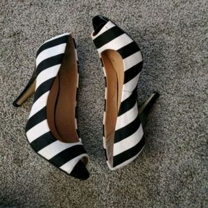Black and white striped pumps